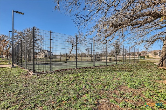 view of yard with tennis court