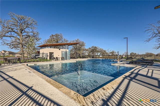 view of swimming pool with a patio area