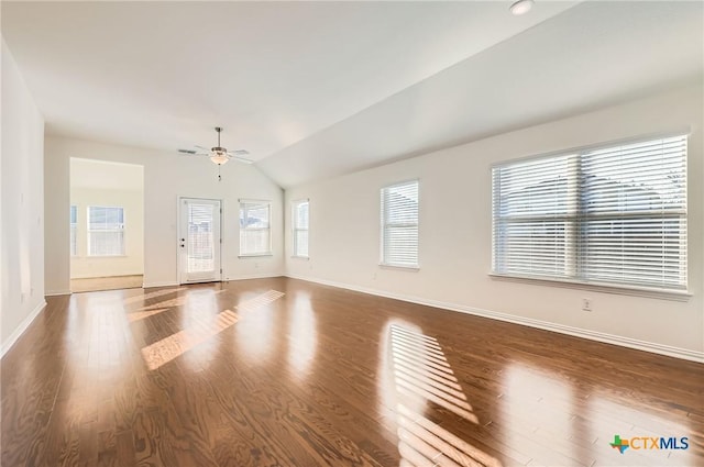 unfurnished living room with ceiling fan, lofted ceiling, and dark wood-type flooring