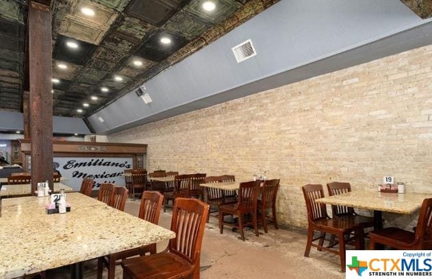 dining space with lofted ceiling