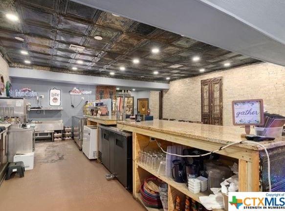 kitchen with washing machine and clothes dryer