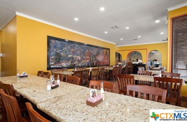 dining room featuring ornamental molding