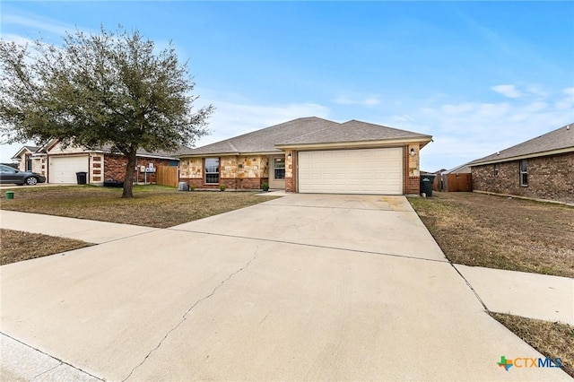 view of front of house featuring a garage and a front yard