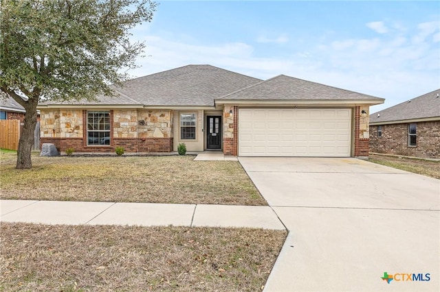 single story home with a garage and a front yard