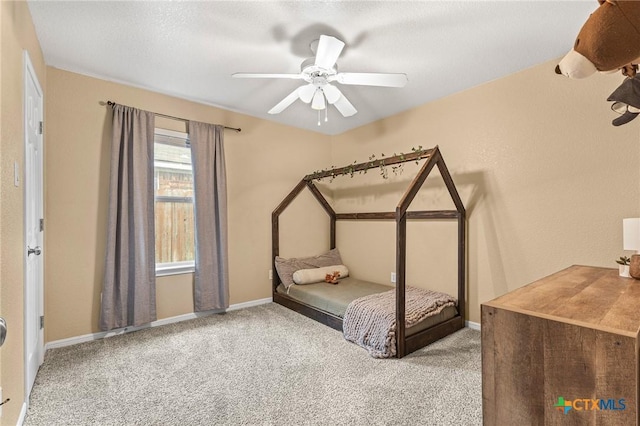 unfurnished bedroom with ceiling fan and carpet flooring