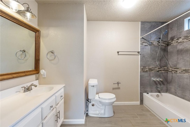 bathroom featuring baseboards, toilet, shower / bathtub combination, a textured ceiling, and vanity