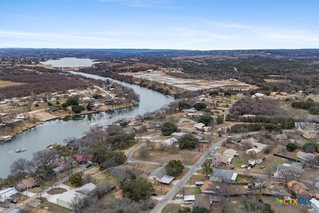 drone / aerial view with a water view and a residential view