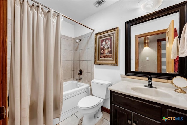 full bathroom featuring tile patterned flooring, vanity, toilet, and shower / bath combo