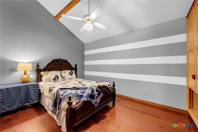 bedroom featuring lofted ceiling with beams, dark hardwood / wood-style flooring, and ceiling fan