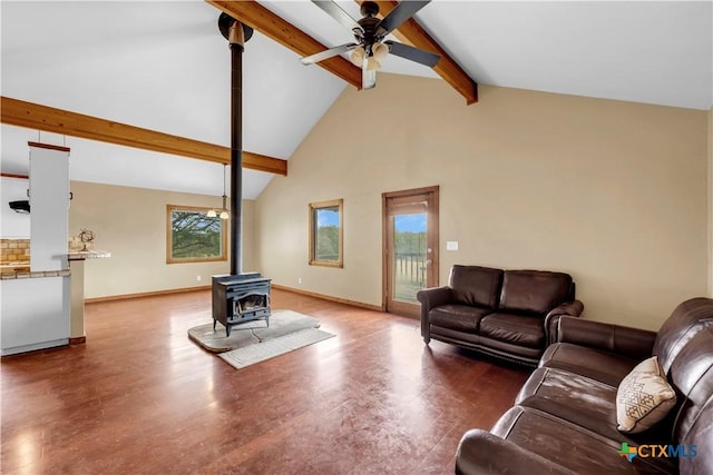 living room featuring ceiling fan, beam ceiling, high vaulted ceiling, dark hardwood / wood-style floors, and a wood stove