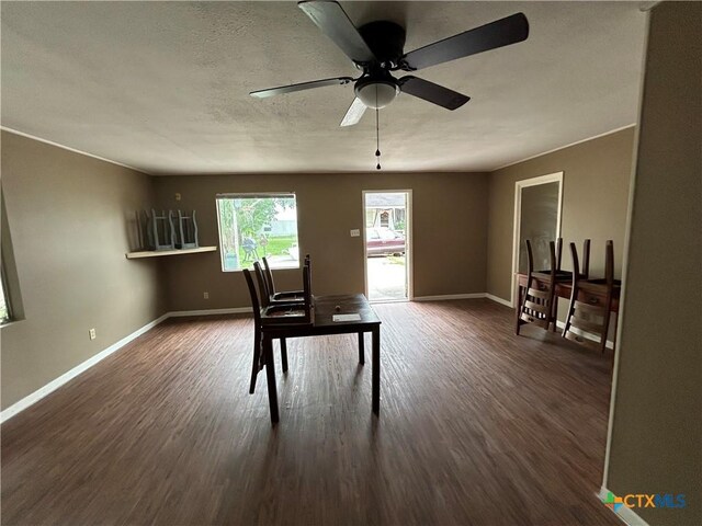 1511 E Constitution St, Victoria, TX 77901 - dining area featuring baseboards, dark wood-style floors, and a ceiling fan