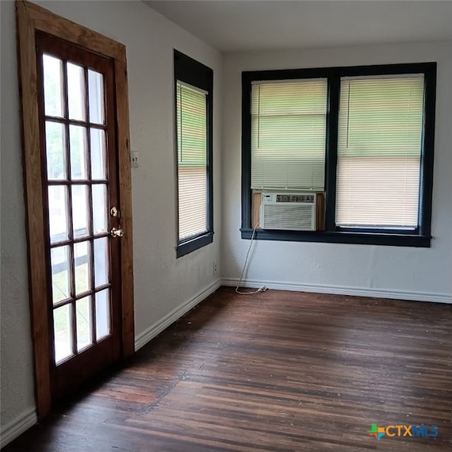 interior space featuring dark wood-type flooring and cooling unit