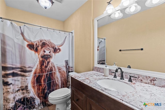 404 Innwood Dr, Georgetown, TX 78628 - bathroom featuring vanity, toilet, and tile patterned flooring