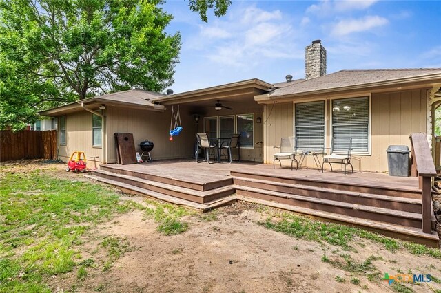 404 Innwood Dr, Georgetown, TX 78628 - rear view of house with fence, a chimney, ceiling fan, and a deck