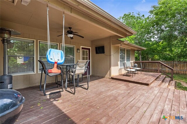 404 Innwood Dr, Georgetown, TX 78628 - wooden deck featuring outdoor dining space, ceiling fan, and fence
