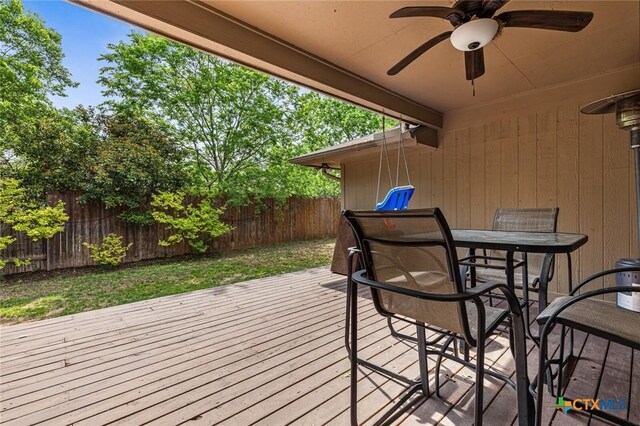 404 Innwood Dr, Georgetown, TX 78628 - wooden terrace featuring fence, outdoor dining area, and ceiling fan