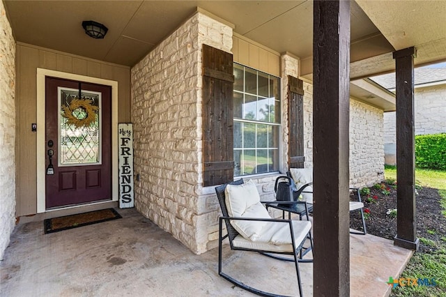 404 Innwood Dr, Georgetown, TX 78628 - property entrance featuring covered porch and stone siding