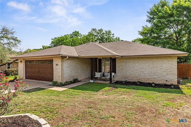 404 Innwood Dr, Georgetown, TX 78628 - ranch-style home featuring stone siding, an attached garage, concrete driveway, and roof with shingles