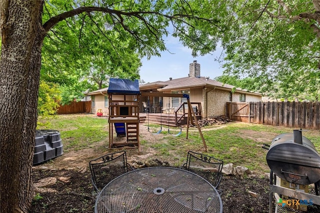 404 Innwood Dr, Georgetown, TX 78628 - rear view of house with outdoor dining area, a fenced backyard, a chimney, a playground, and central AC unit