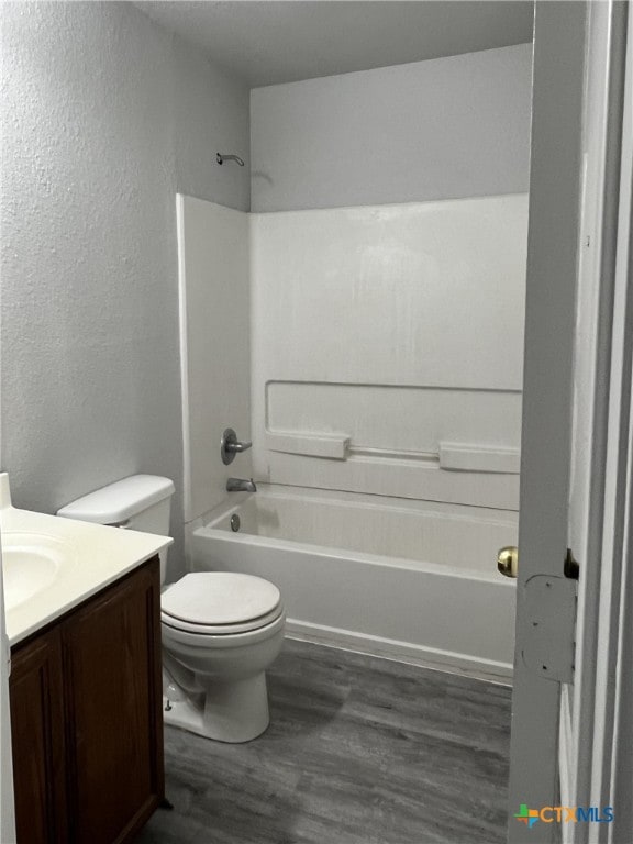 8619 Key N Way, Converse, TX 78109 - bathroom with vanity, wood finished floors, toilet, shower / tub combination, and a textured wall