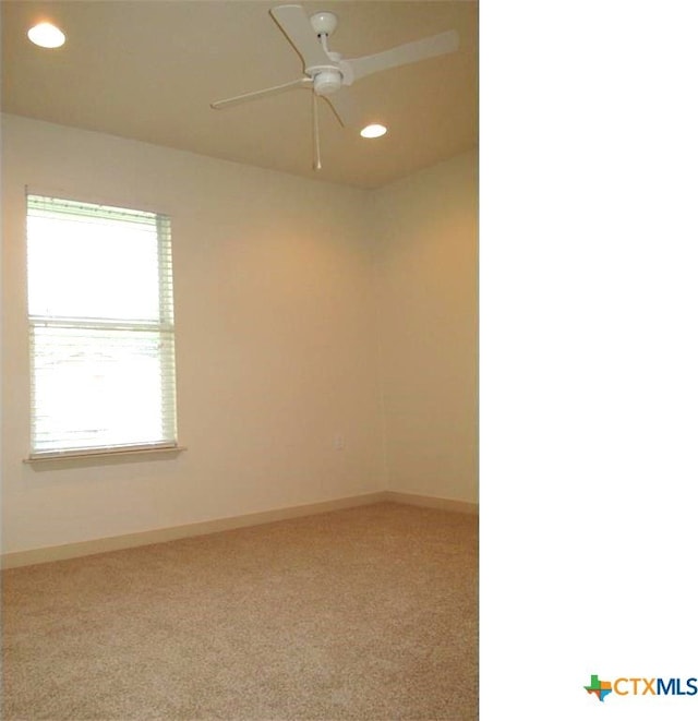 empty room with carpet and ceiling fan