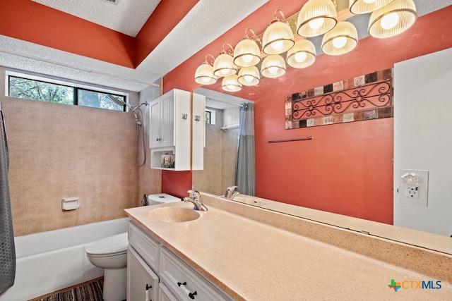 full bathroom featuring vanity, a textured ceiling, toilet, and shower / bath combination with curtain