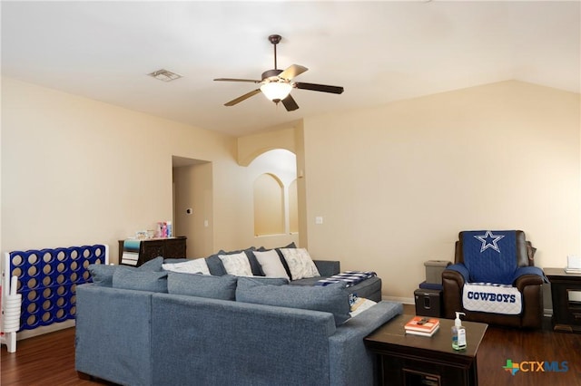 319 Silverado Trl, Victoria, TX 77901 - living area with wood finished floors, vaulted ceiling, a ceiling fan, and visible vents