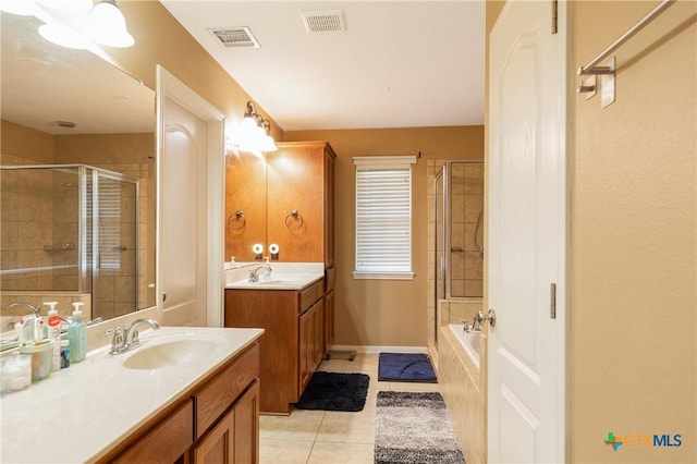 319 Silverado Trl, Victoria, TX 77901 - bathroom with a sink, visible vents, and a tile shower