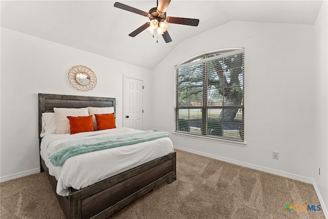 carpeted bedroom with lofted ceiling, ceiling fan, and baseboards