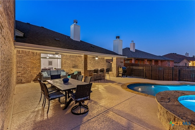 view of swimming pool with a fenced in pool, outdoor dining space, a patio area, and fence