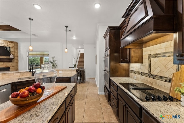 kitchen featuring black electric stovetop, custom range hood, decorative backsplash, light tile patterned flooring, and dark brown cabinetry