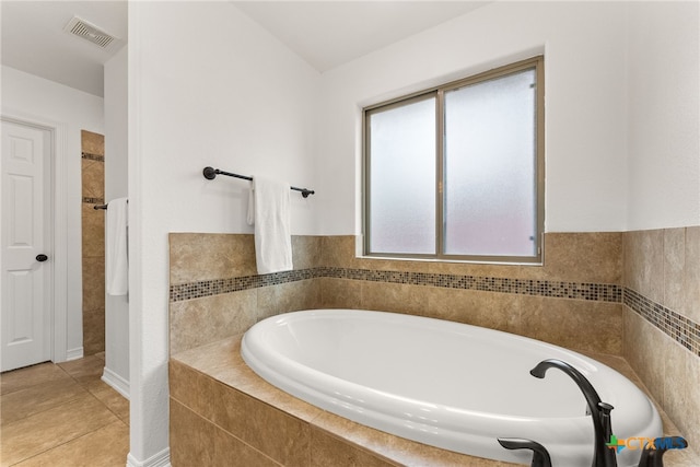 full bath with tile patterned flooring, visible vents, and a bath