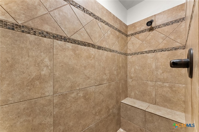 details featuring tiled shower