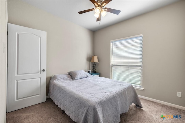 2206 Hayes St, Temple, TX 76502 - bedroom with carpet flooring, multiple windows, baseboards, and ceiling fan