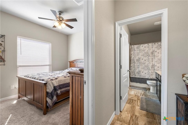 2206 Hayes St, Temple, TX 76502 - bedroom featuring baseboards, ensuite bath, and ceiling fan