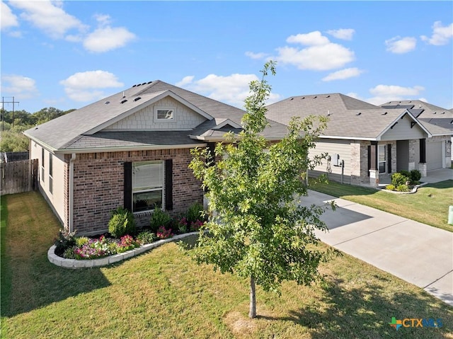 2206 Hayes St, Temple, TX 76502 - view of front facade featuring brick siding and driveway