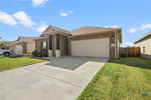 2206 Hayes St, Temple, TX 76502 - ranch-style home featuring brick siding, driveway, an attached garage, and central AC unit