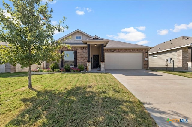 2206 Hayes St, Temple, TX 76502 - view of front facade with an attached garage, brick siding, concrete driveway, and a front yard