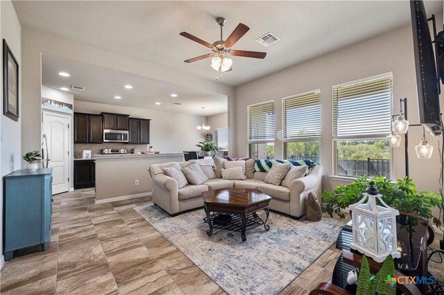 2206 Hayes St, Temple, TX 76502 - living area featuring a ceiling fan, recessed lighting, and a chandelier