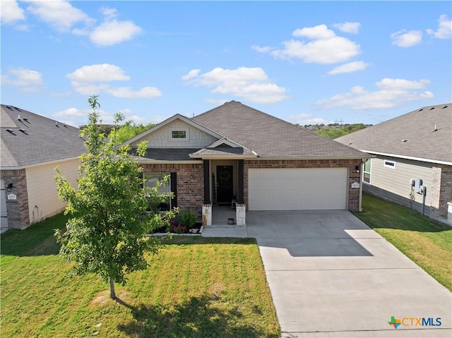 2206 Hayes St, Temple, TX 76502 - view of front of home featuring brick siding, an attached garage, driveway, and a front lawn