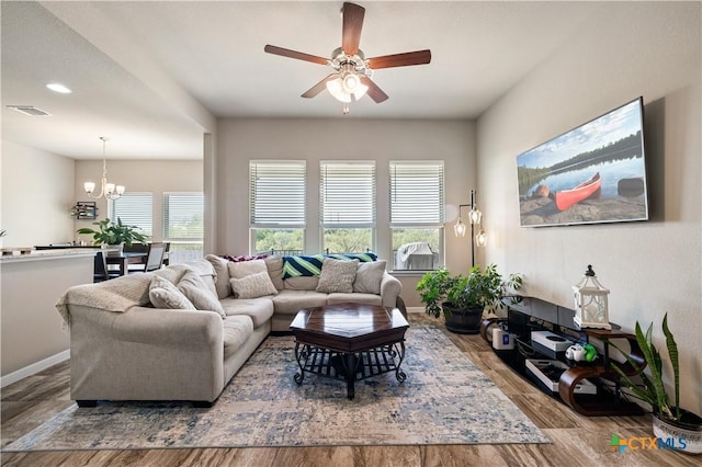2206 Hayes St, Temple, TX 76502 - living room with ceiling fan, a chandelier, wood finished floors, baseboards, and recessed lighting