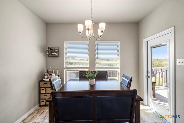 2206 Hayes St, Temple, TX 76502 - dining area featuring a chandelier, plenty of natural light, and light wood finished floors