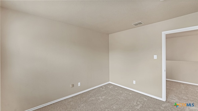 spare room featuring carpet flooring