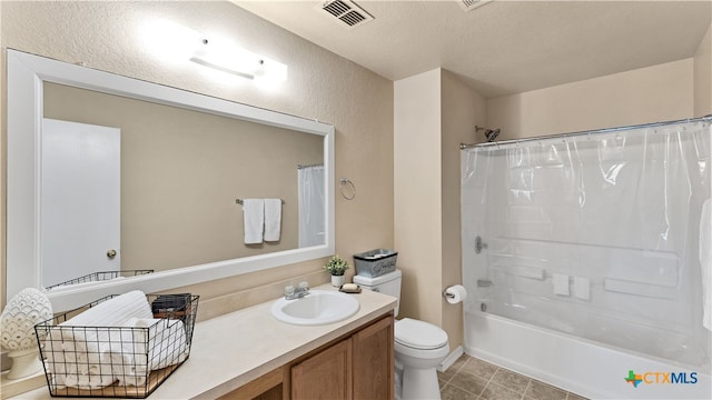 full bathroom with a textured ceiling, vanity, shower / bath combo with shower curtain, and toilet