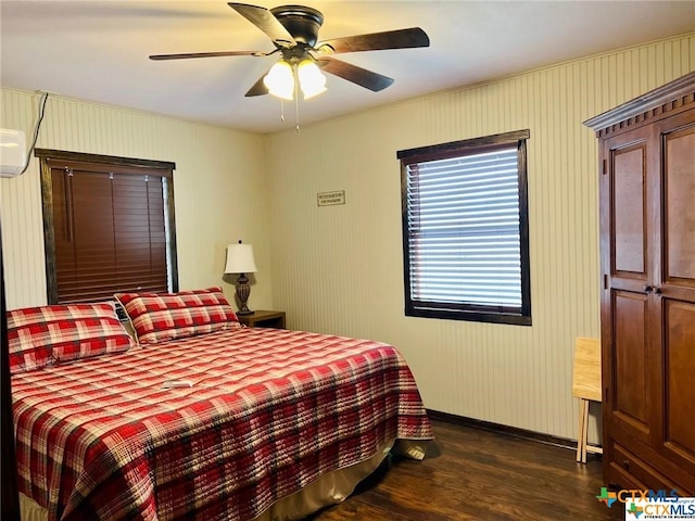 bedroom with dark hardwood / wood-style floors and ceiling fan