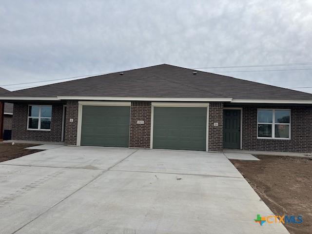 ranch-style house featuring a garage