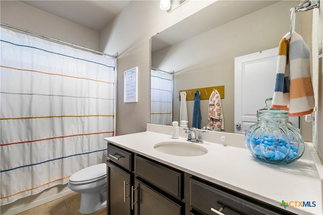 bathroom with toilet, tile patterned floors, shower / bath combo, and vanity