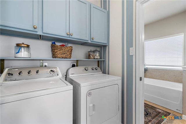 laundry area with cabinet space and washing machine and dryer