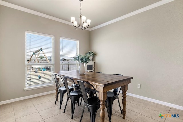 dining room featuring baseboards, ornamental molding, a notable chandelier, and light tile patterned flooring