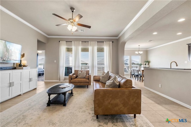 living area featuring visible vents, crown molding, baseboards, and light tile patterned floors